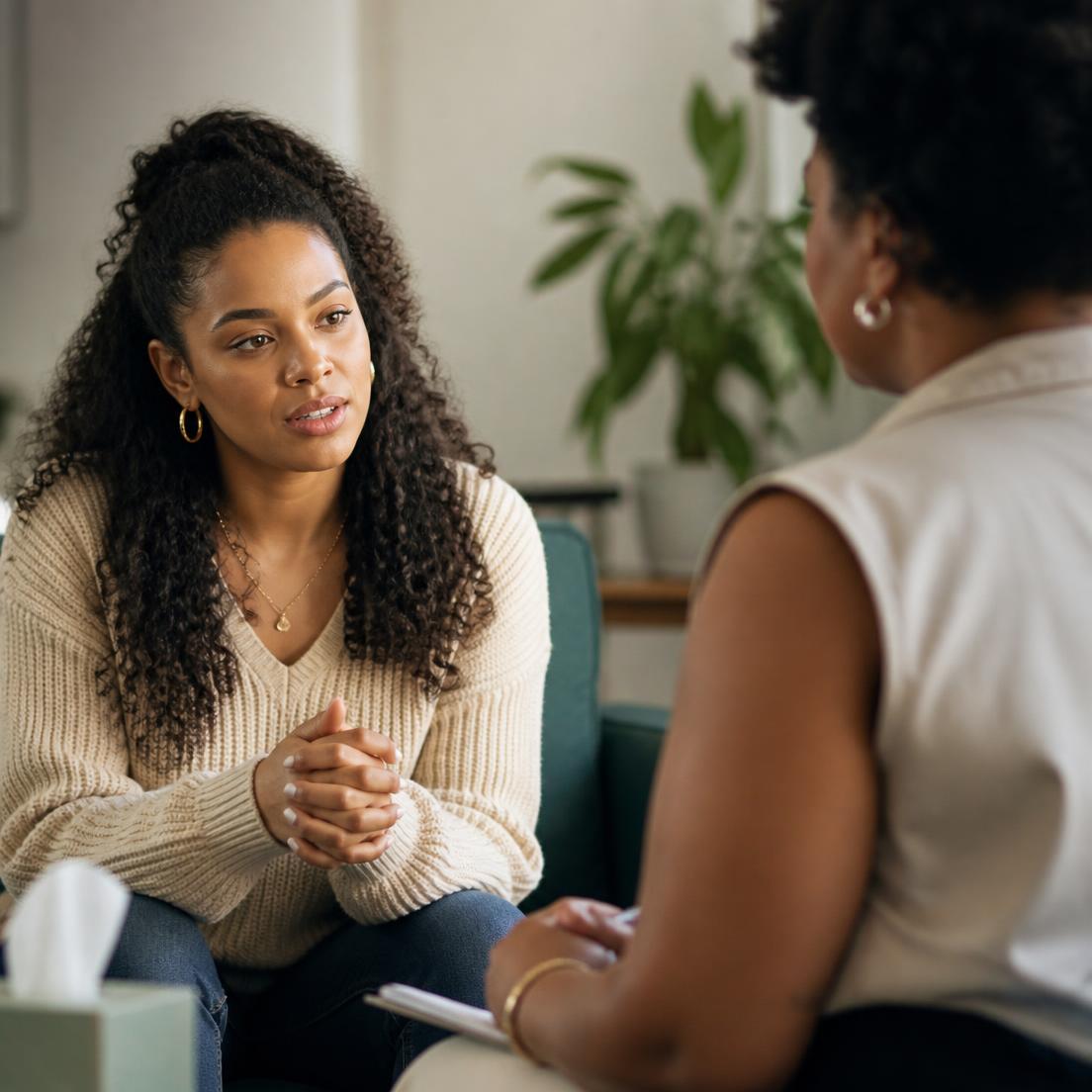 A Caribbean client receiving calm, attentive emotional support during a counselling session